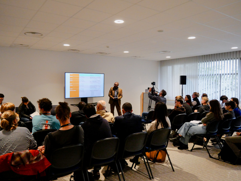 Photo of a speaker delivering a talk during a workshop at Sea Tech Week® 2024.